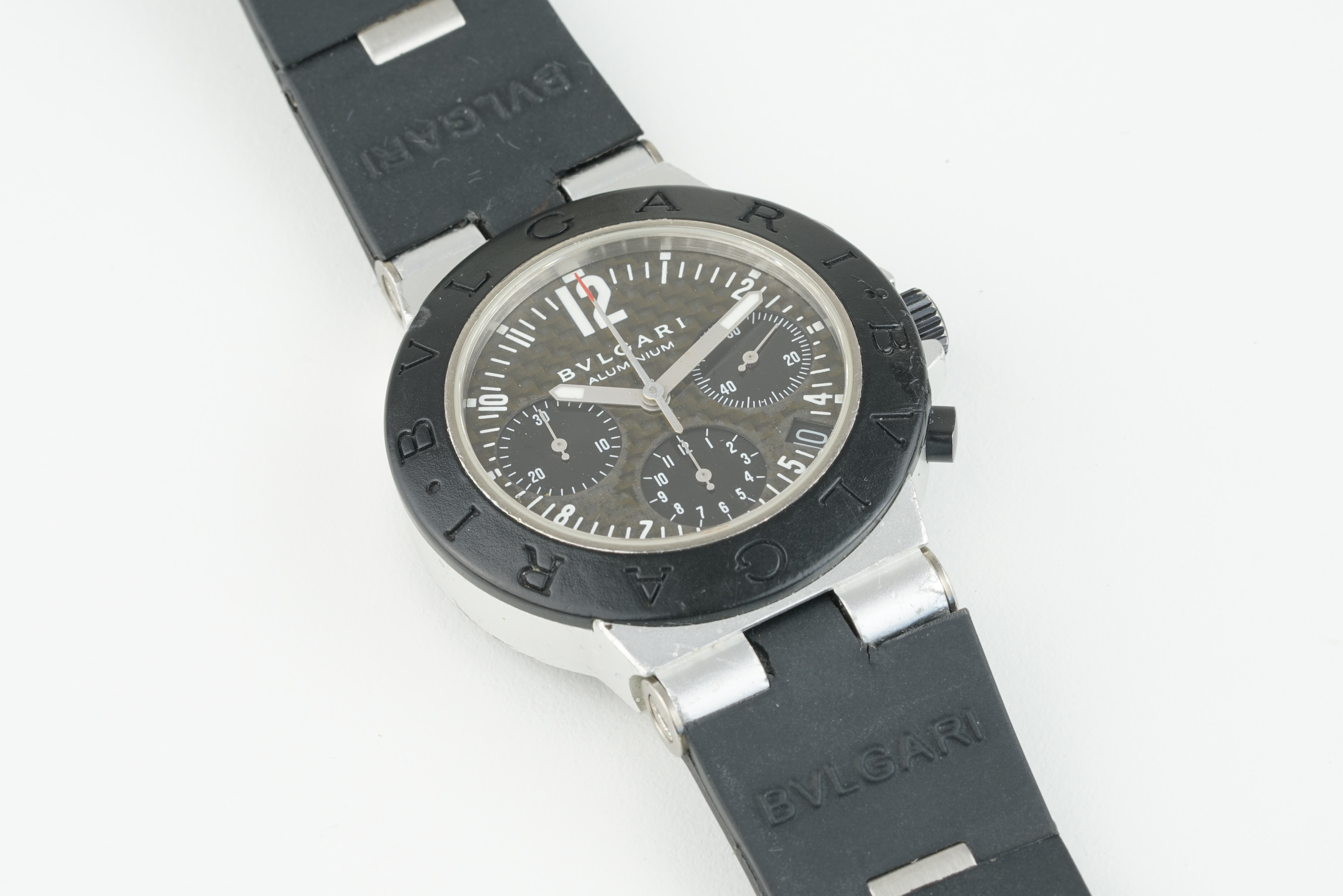 BULGARI ALUMINIUM CHRONOGRAPH WRISTWATCH, circular triple register dial with hour markers and hands,