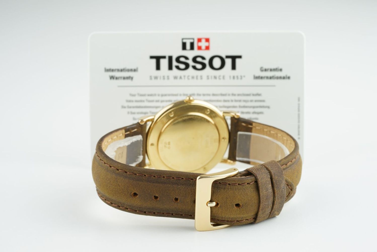 GENTLEMENS TISSOT 18CT GOLD DATE WRISTWATCH W/ WARRANTY CARD, circular white dial with roman numeral - Image 3 of 3