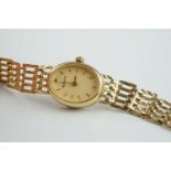 LADIES ACCURIST 9CT GOLD COCKTAIL WRISTWATCH, oval champagne dial with stick hour markers and hands,