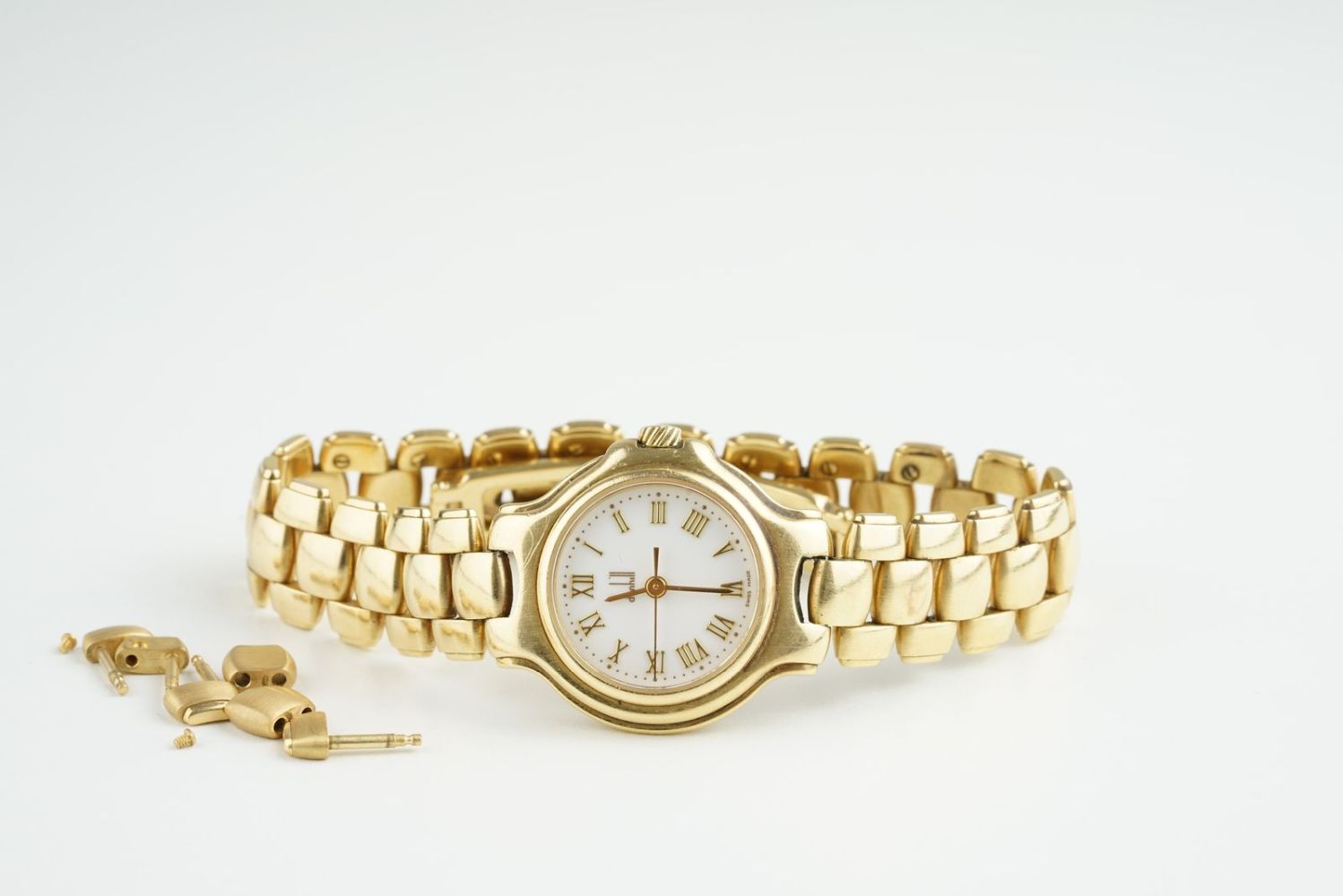 LADIES DUNHILL 18CT GOLD WRISTWATCH, circular white dial with gold roman numeral hour markers and