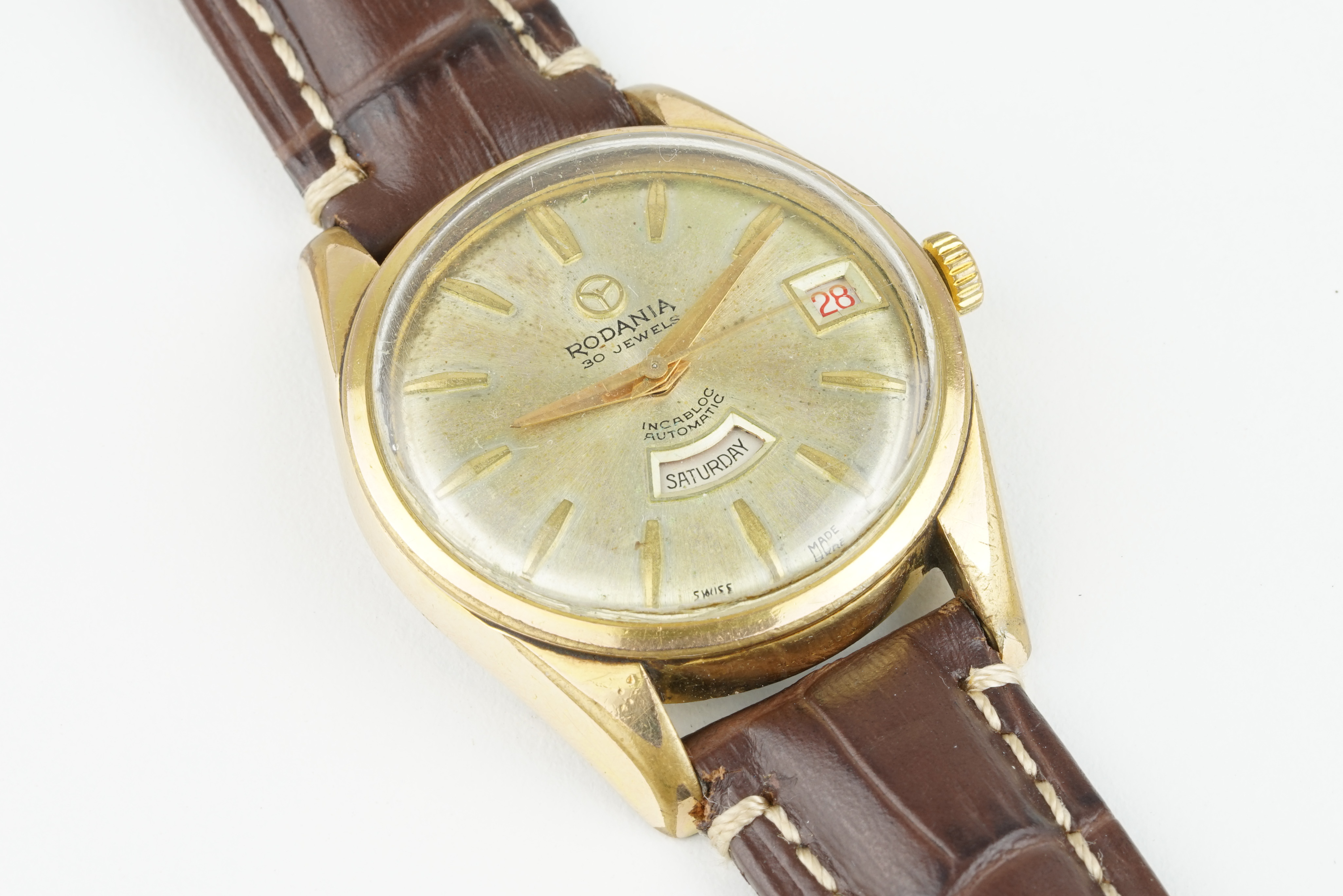 RODANIA AUTOMATIC DAY DATE WRISTWATCH, circular gold dial with hour markers and hands, day date