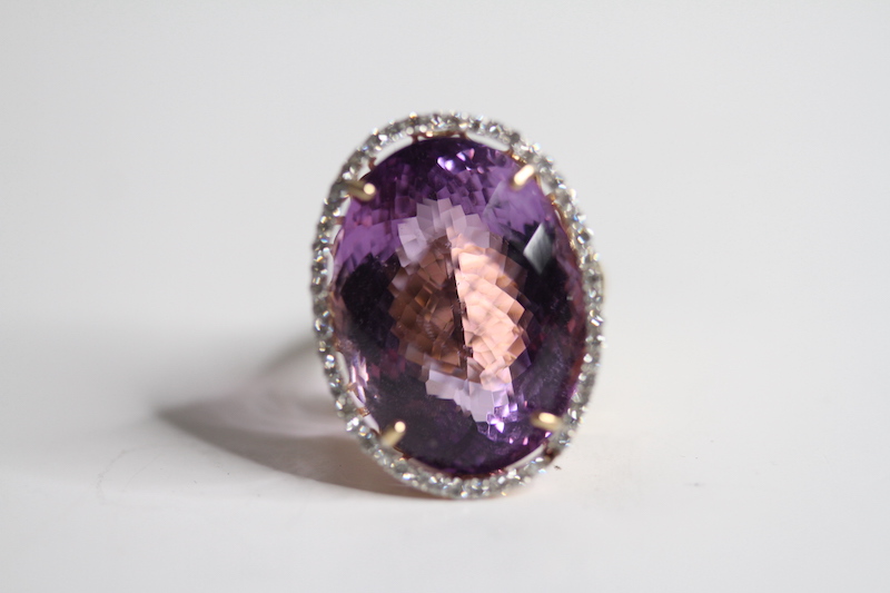 14ct Amethyst and Diamond Ring, estimated weight 25carats 11.2g Size O