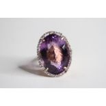 14ct Amethyst and Diamond Ring, estimated weight 25carats 11.2g Size O