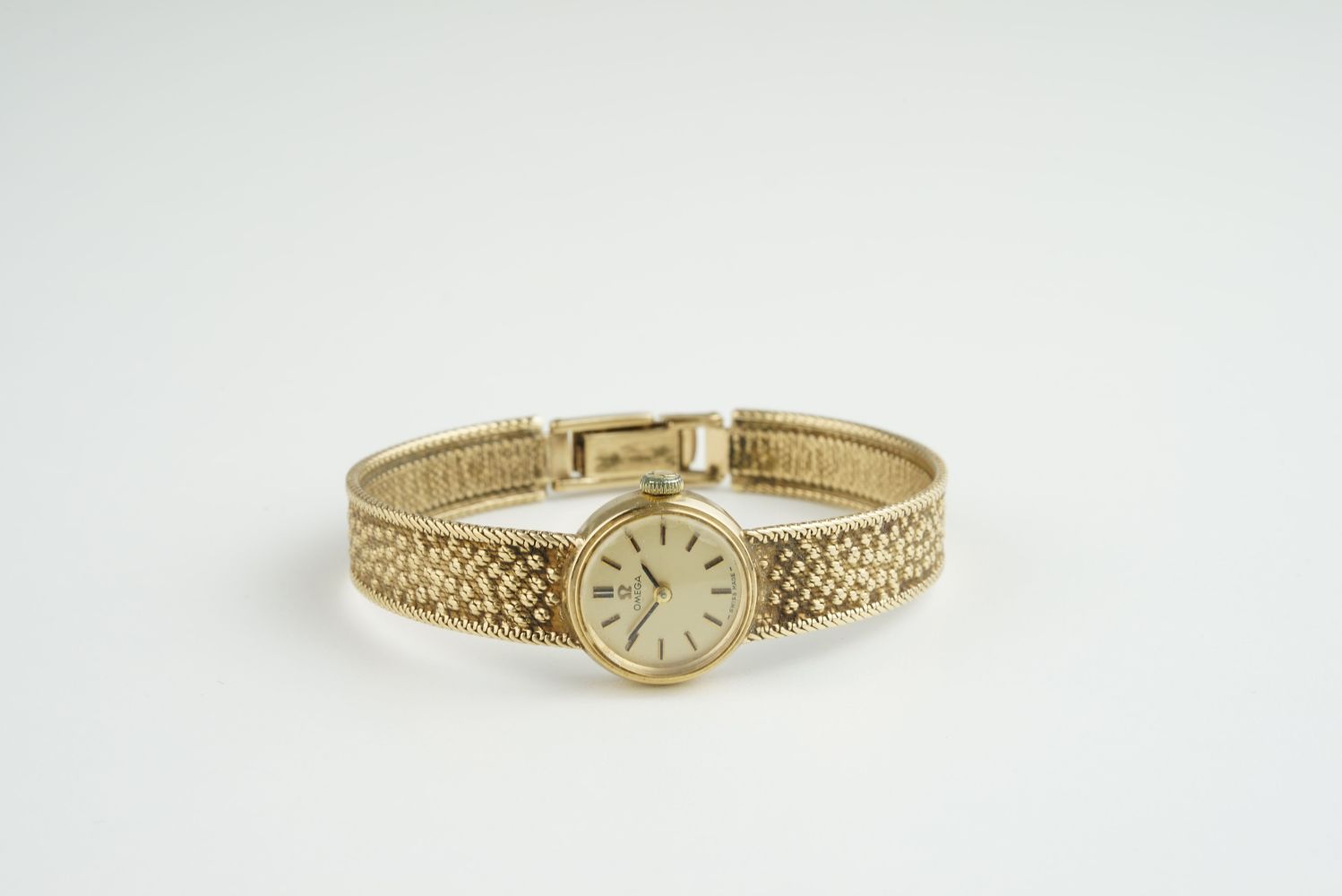 LADIES OMEGA 9CT GOLD COCKTAIL WATCH, circular gold dial with stick hour markers and hands, 17mm 9ct