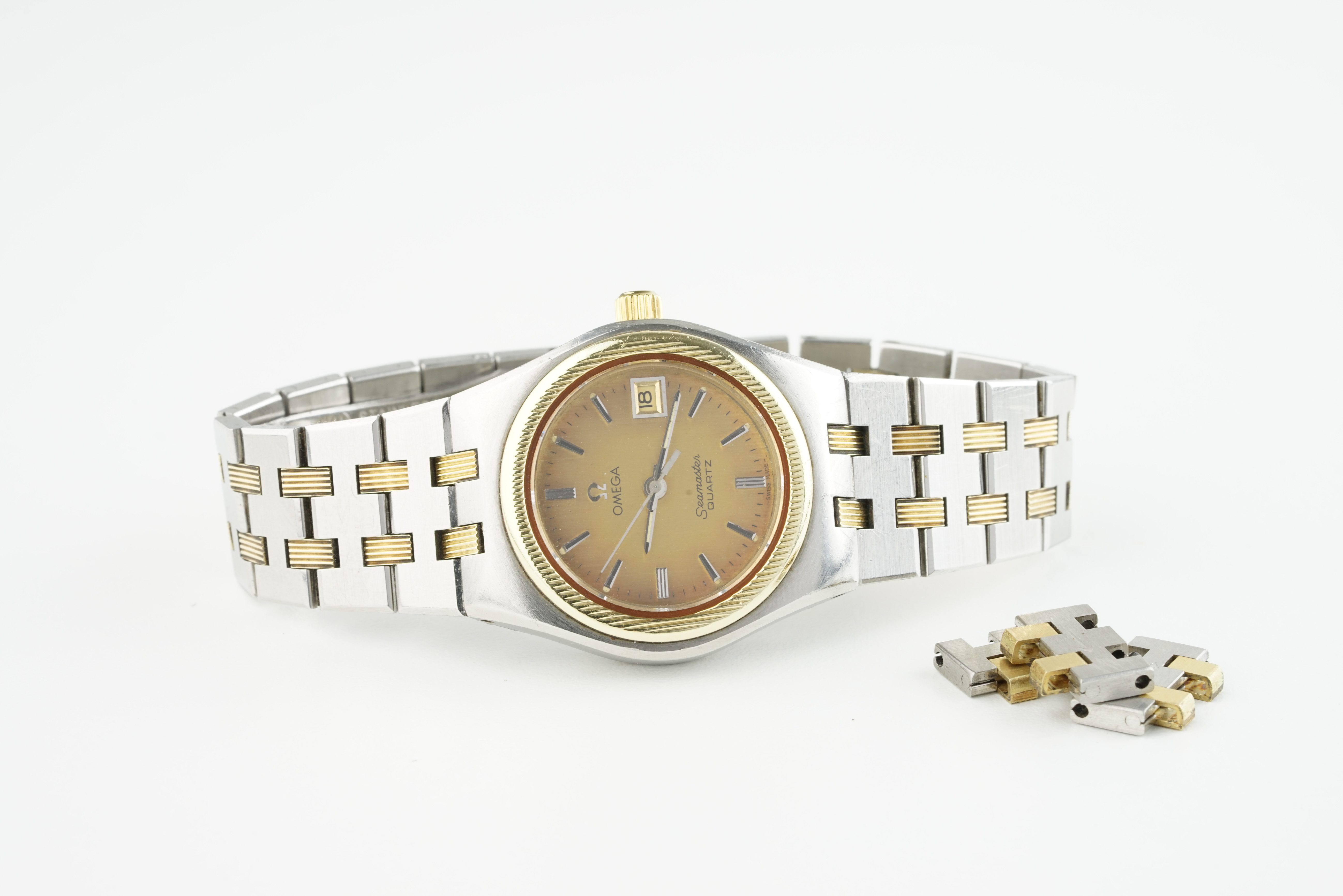 LADIES OMEGA SEAMASTER QUARTZ WRISTWATCH, circular gold dial with hour markers and hands, date