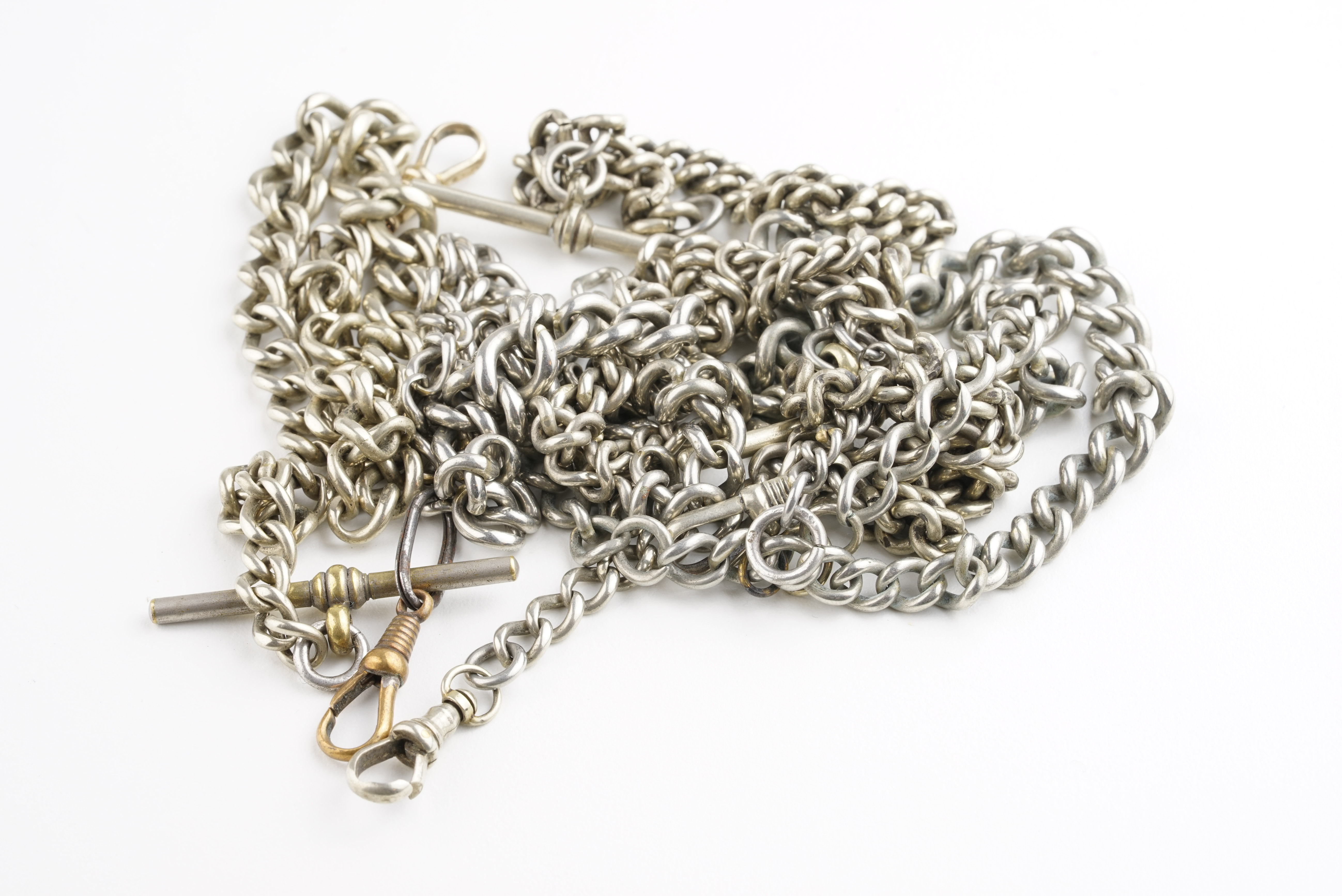 GROUP OF 5 ALBERT CHAINS, group of 5 white metal albert chains, untested, gross weight 124.58g.***