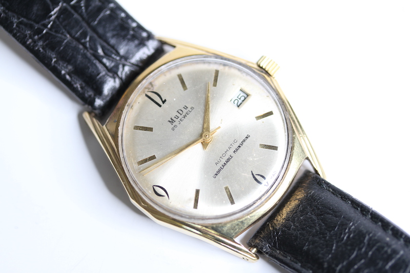 VINTAGE MUDU AUTOMATIC, gilt dial, baton and Arabic numerals, gold plated case, screw down case