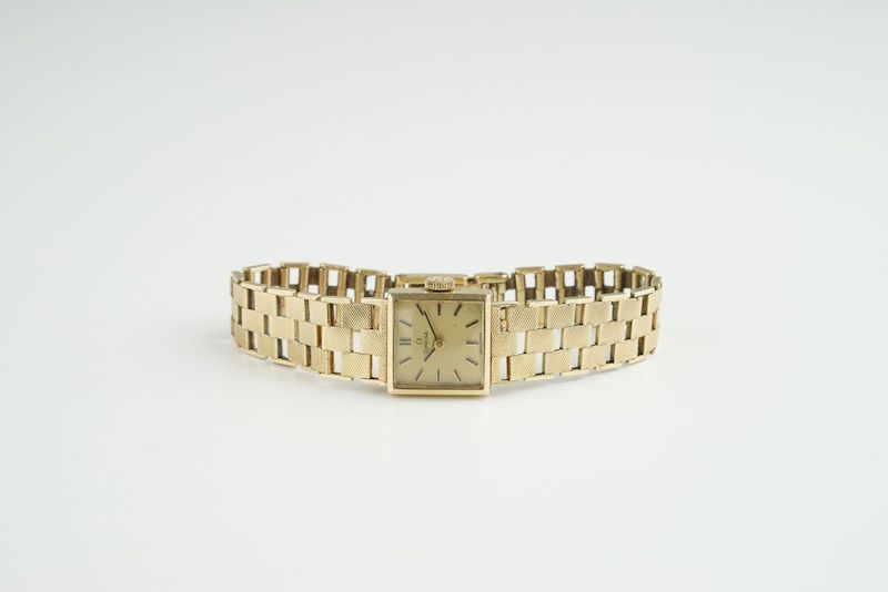 LADIES OMEGA 9CT GOLD WRISTWATCH, square gold dial with stick hour markers and hands, 15mm 9ct