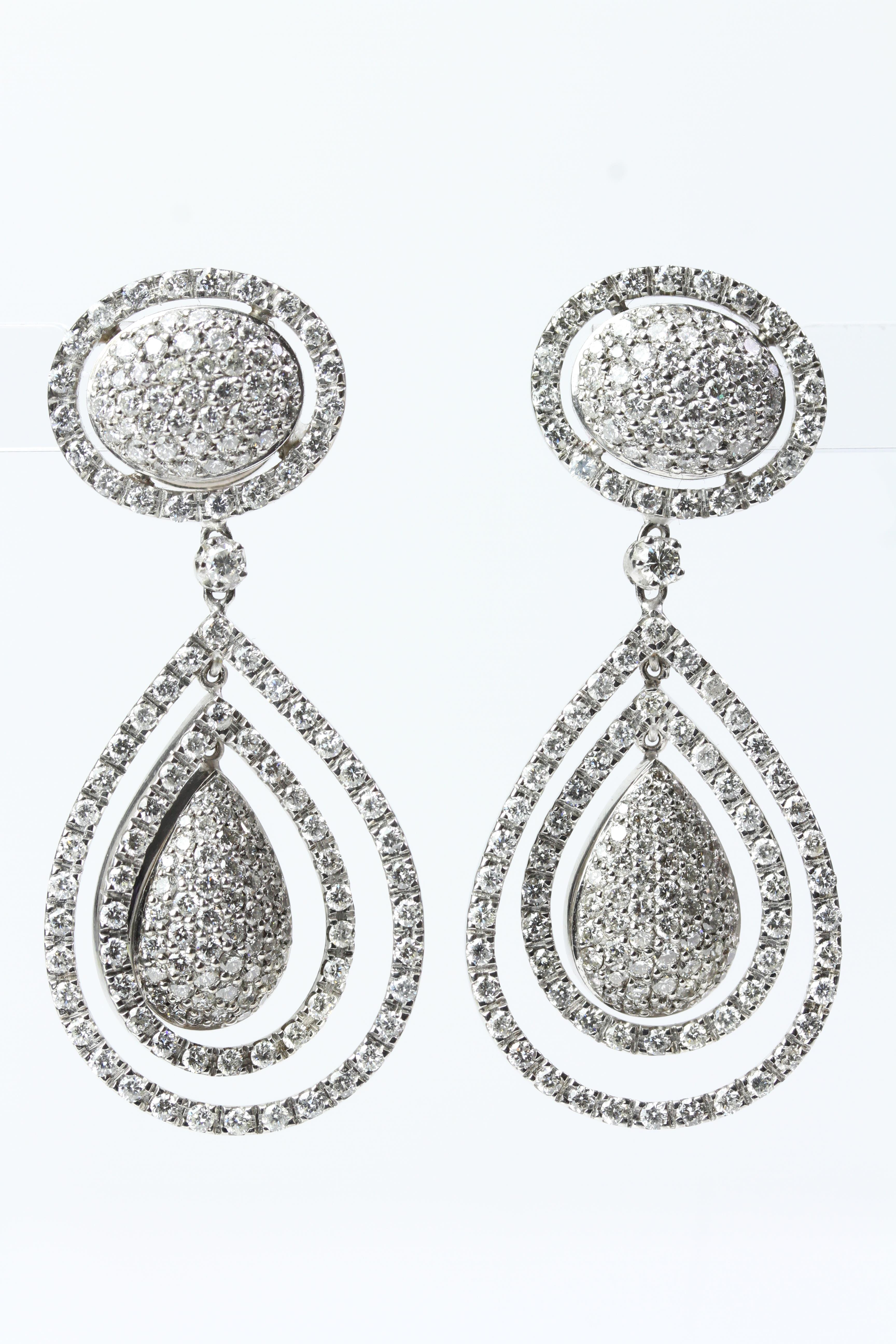 18WG Large pave set pear shaped domes with double moveable halos suspended from an oval pave set