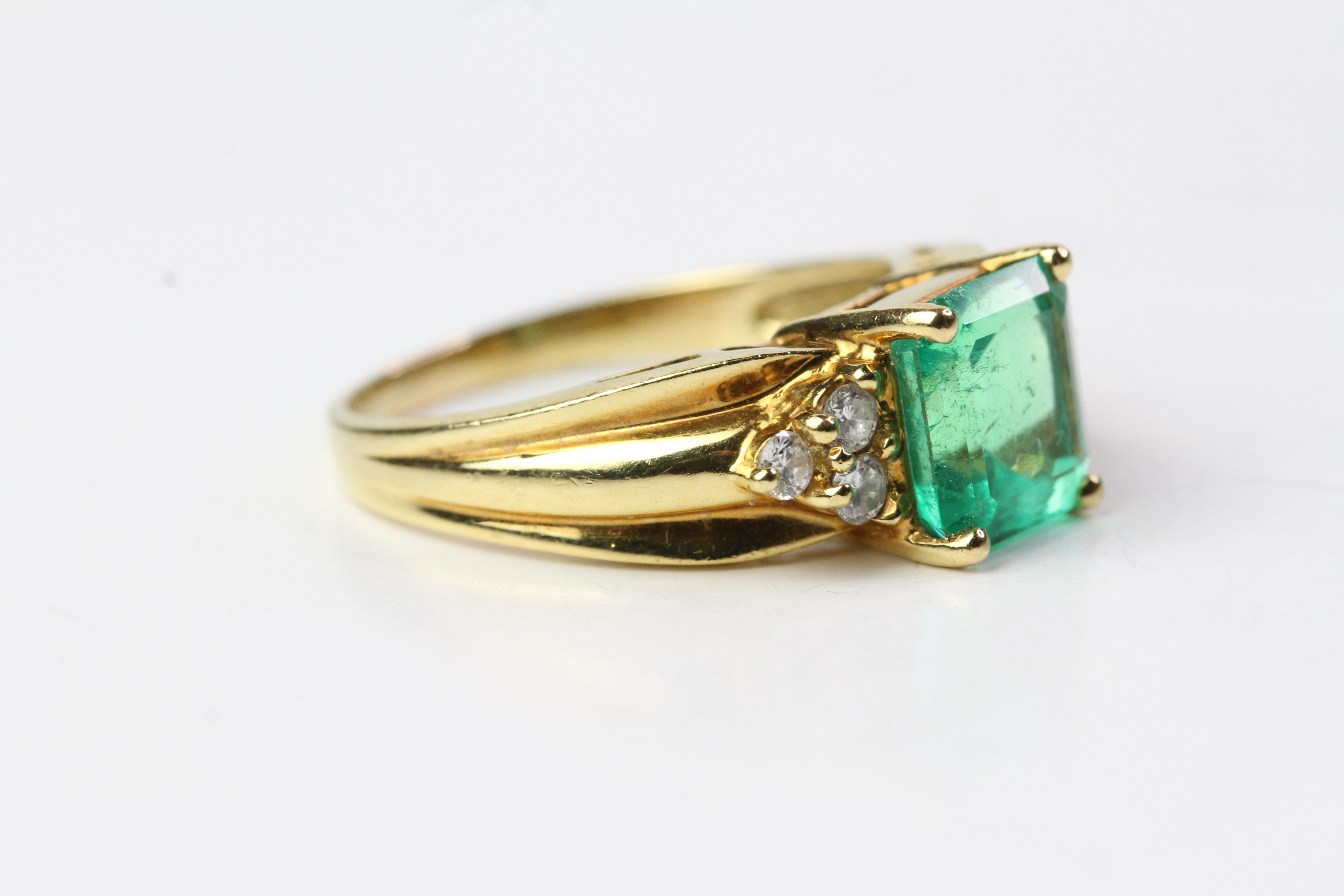 18YG Emerald and diamond ring, Square step cut emerald with 3 brilliant cut diamonds each side. ( - Image 2 of 3