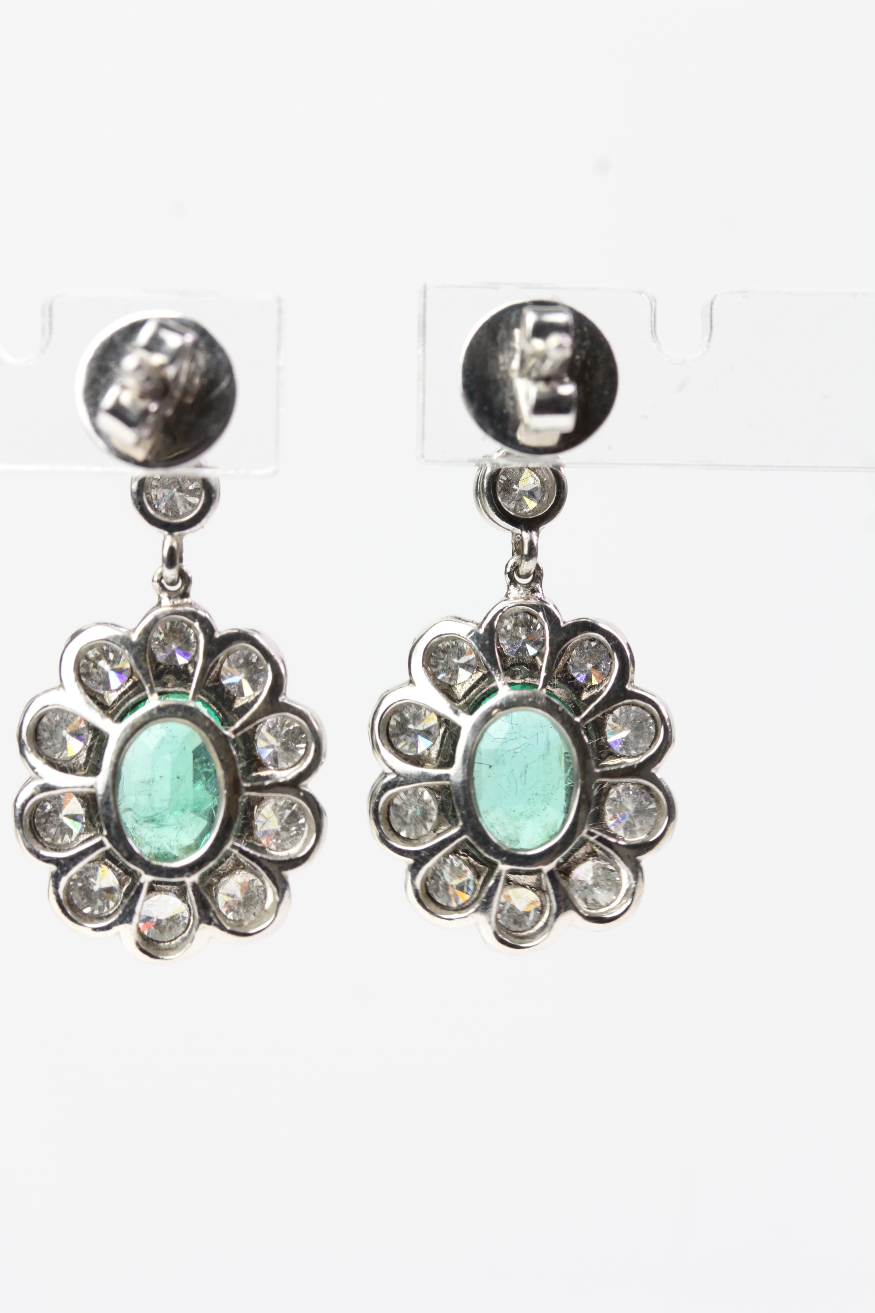 18WG Oval emerald and diamond cluster drop earrings suspended on 2 bezel set diamonds E 3.03 D2.01 - Image 2 of 2