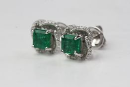 18WG Square emeralds with detachable diamond petals. E1.91 D0.32