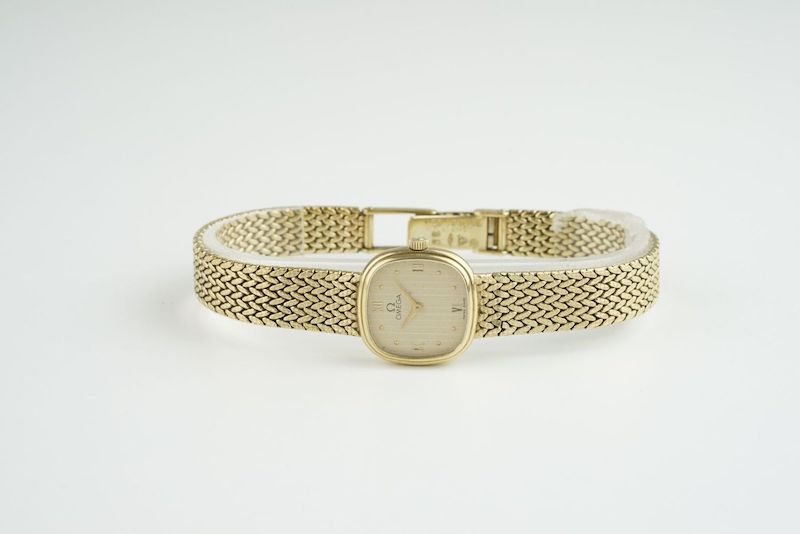 LADIES OMEGA 9CT GOLD COCKTAIL WATCH, rounded gold dial with hour markers and hands, 18mm 9ct gold