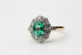 18YG Oval emerald and diamond cluster ring with diamond at each shoulder top E 1ct D 1.25ct