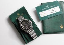 ROLEX 'DOUBLE RED' SEA-DWELLER 1665 BOX AND SERVICE PAPER 1973