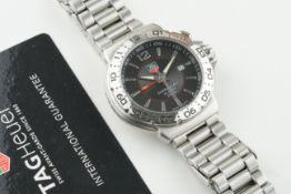 TAG HEUER FORMULA 1 ALARM WRISTWATCH W/ GUARANTEE CARD, circular black dial with hour markers and