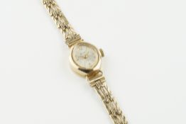 ACCURIST 9CT GOLD COCKTAIL WATCH, oval silver dial with hour markers and hands, 15mm 9ct gold case