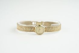 LADIES OMEGA 9CT GOLD COCKTAIL WATCH, circular gold dial with stick hour markers and hands, 17mm 9ct