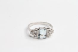 Platinum Aqua and diamond ring - central bezel set step cut aqua with square collet set diamond