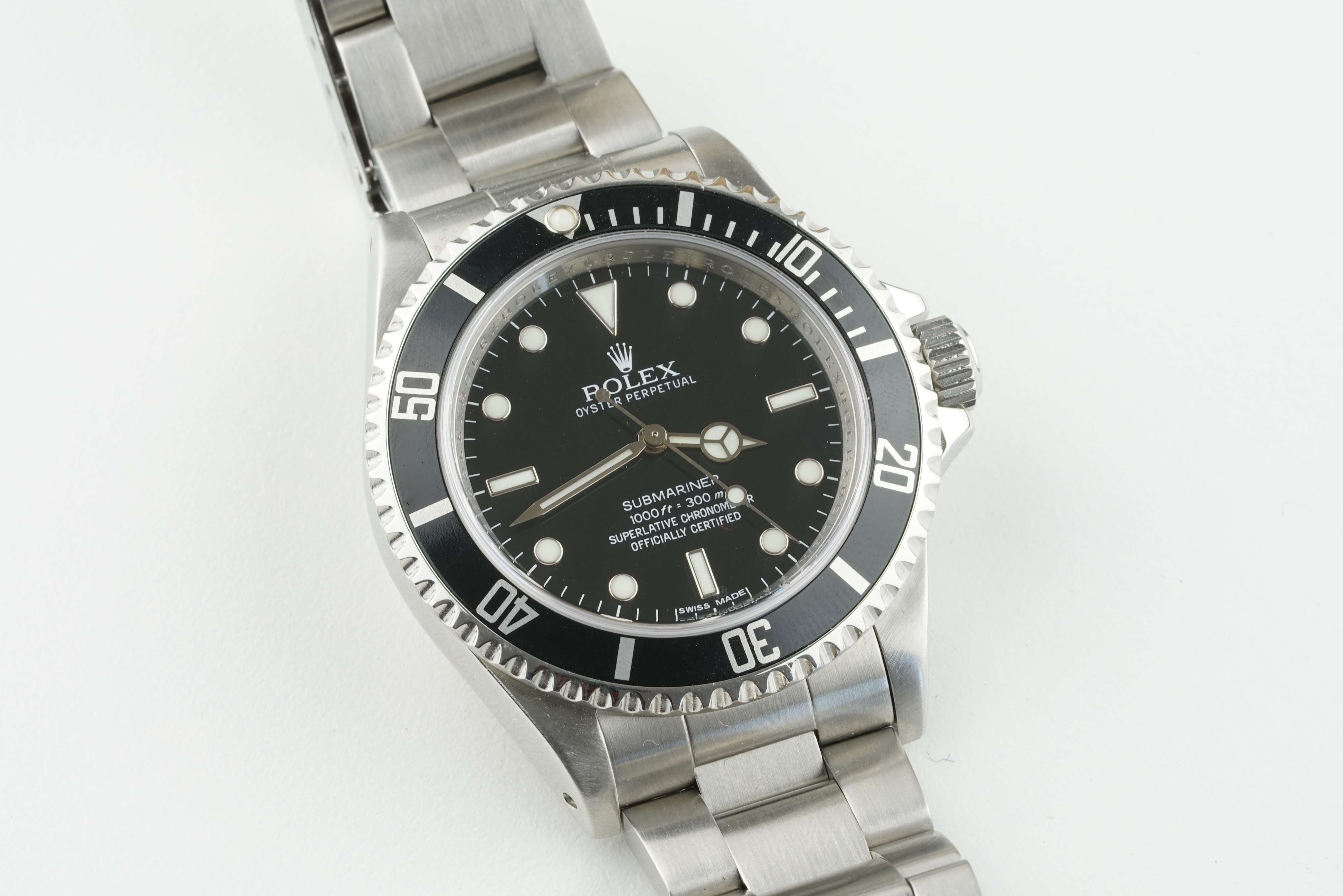 ROLEX OYSTER PERPETUAL SUBMARINER 4 LINER WRISTWATCH REF. 14060M RANDOM SERIAL, circular black