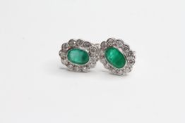 18WG Emerald and diamond cluster studs mille grain bezel set diamonds and oval emerald E1.66 D0.80