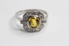 Plat yellow sapphire and diamond cluster ring with highlighted diamonds at the shoulders YS 1.60 D