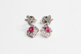 18WG ruby and diamond small drop earrings (Luke Stockley)