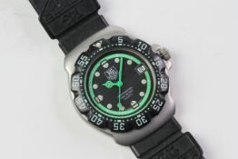 VINTAGE TAG HEUER FORMULA 1 PROFESSIONAL 200M 'GHOSTBUSTER' REFERENCE WA1215, black dial with lime