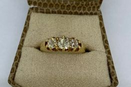 YG gypsy style claw set 3 stone ring stamped 18CT Est weight 1ct old cuts size K