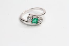 Emerald and Diamond 3 stone cross over ring