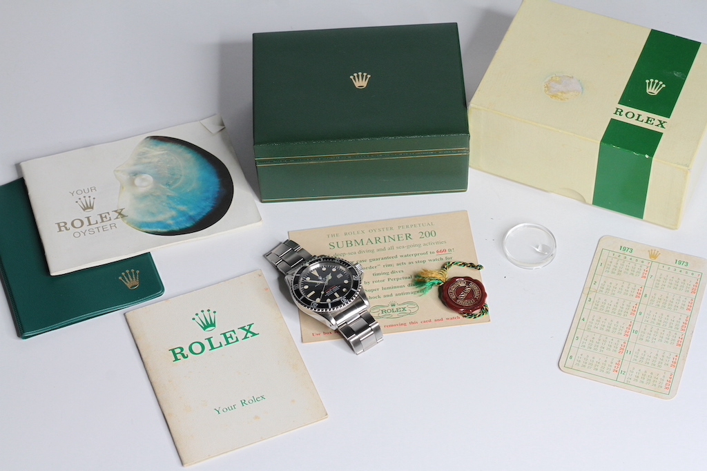 ROLEX 'RED LINE' SUBMARINER 1680 BOX AND SERVICE PAPER 1972