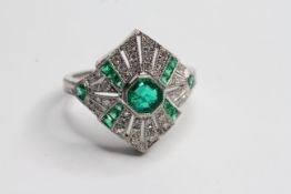 Platinum Deco Style emerald and diamond ring. Central Emerald 0.39 cts