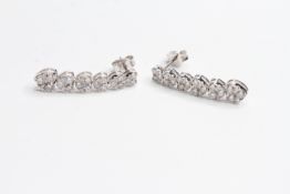 18WG long drop earrings of heart shaped collets with round brilliant diamonds. Est 2cts