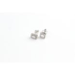 18ct illusion diamond studs with halos. Baguette and RB D0.64