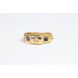 18ct gold ring with sapphire and diamond ring with engraved shoulders