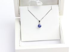 Sapphire and Diamond 18ct pendant, round cut blue sapphire with a brilliant cut diamond top, 18ct