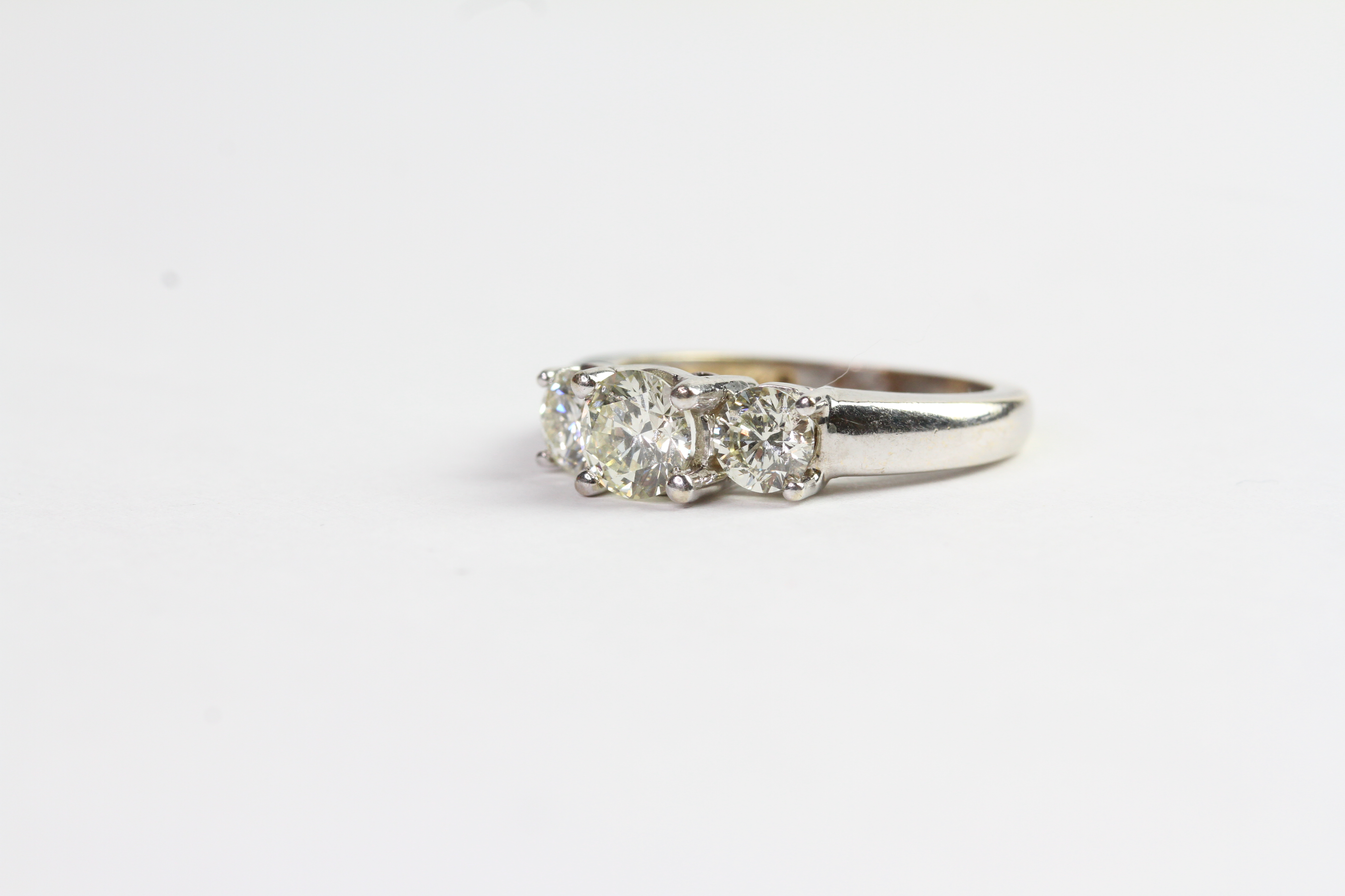 1.31ct Three Stone Diamond Ring, three brilliant cut diamonds estimated 0.34/0.63/0.34ct, tested - Image 2 of 3