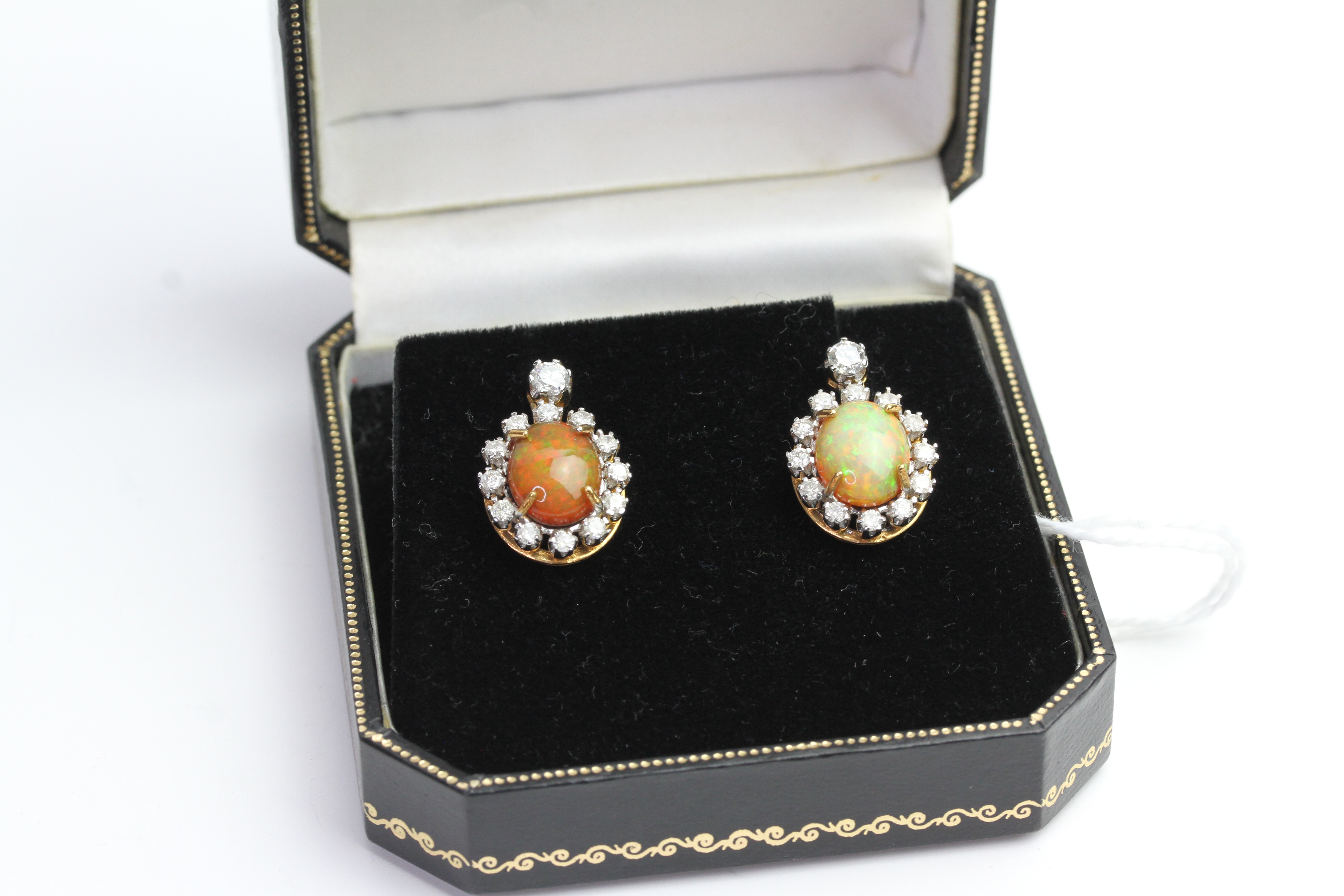 Pair of Opal and Diamond earrings, comes with box.