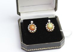 Pair of Opal and Diamond earrings, comes with box.