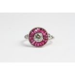 Tests 18 carat white gold ruby target ring with detailed shoulders and shank Ring size N