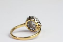 18ct claw set oval yellow sapphire and diamond cluster ring, the shoulders have 3 diamonds each