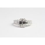 18ct illusion set ring in shape of emerald cut with diamond shoulders. Total diamond weight 1.45cts