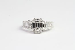 18ct illusion set ring in shape of emerald cut with diamond shoulders. Total diamond weight 1.45cts