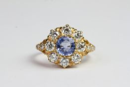 18ct Sapphire and diamond crown cluster ring with 3 diamonds on shoulders. S1.20 D 1.45