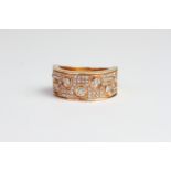 18ct wide band ring with pave set diamonds and diamonds in circle bezels D0.59 stamped inside with