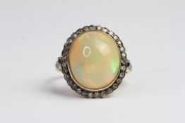Silverset ethiopian opal and diamond ring, silverset and gold. Marked 585