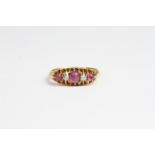 18ct gold ring with Purple sapphire and cabechon cut diamond