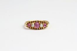 18ct gold ring with Purple sapphire and cabechon cut diamond
