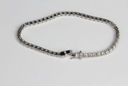 18ct Diamond claw set line bracelet D5.65 52 diamonds. 2 ‘d’ clip safety catches.