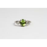 18ct Peridot and diamond 3 stone ring. No weights known Ring size O